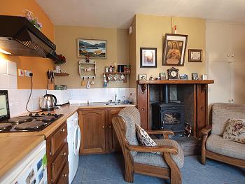Fitted kitchen and solid fuel stove